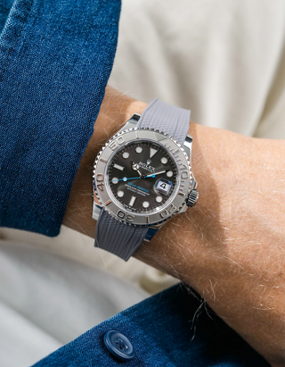 Close-up of a person wearing a Rolex YachtMaster 2 126622 / 116622 model watch with a blue shirt sleeve and a Capri grey Vertech FKM rubber watch strap from Wristbuddys