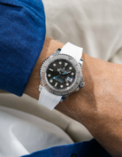 Close-up of a person wearing a Rolex YachtMaster 2 126622 / 116622 model watch with a blue shirt sleeve and a Capri white Vertech FKM rubber watch strap from Wristbuddys