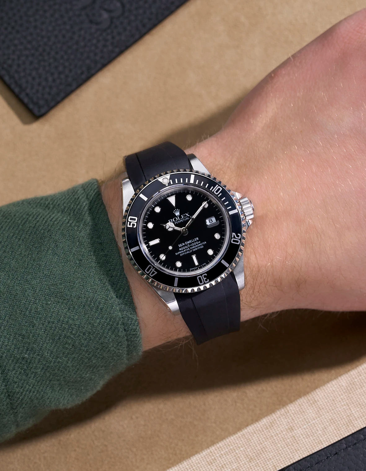 Rolex Sea-Dweller 16600 on wrist with integrated black rubber strap and original clasp