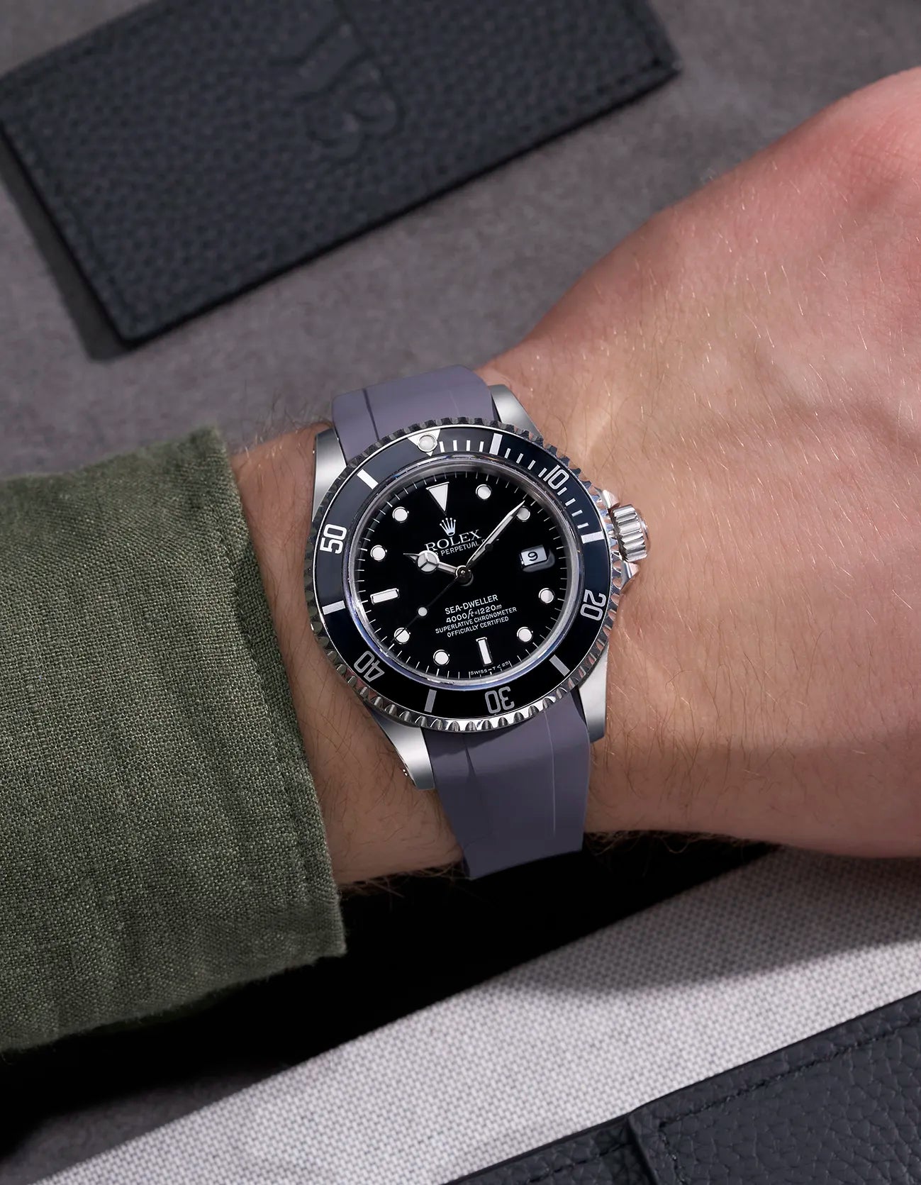 Wrist shot of Rolex Sea-Dweller 16600 on grey FKM rubber strap with original clasp for perfect fit
