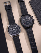 Side-by-side comparison of Omega Speedmaster and Dark Side of the Moon watches featuring black alligator leather straps