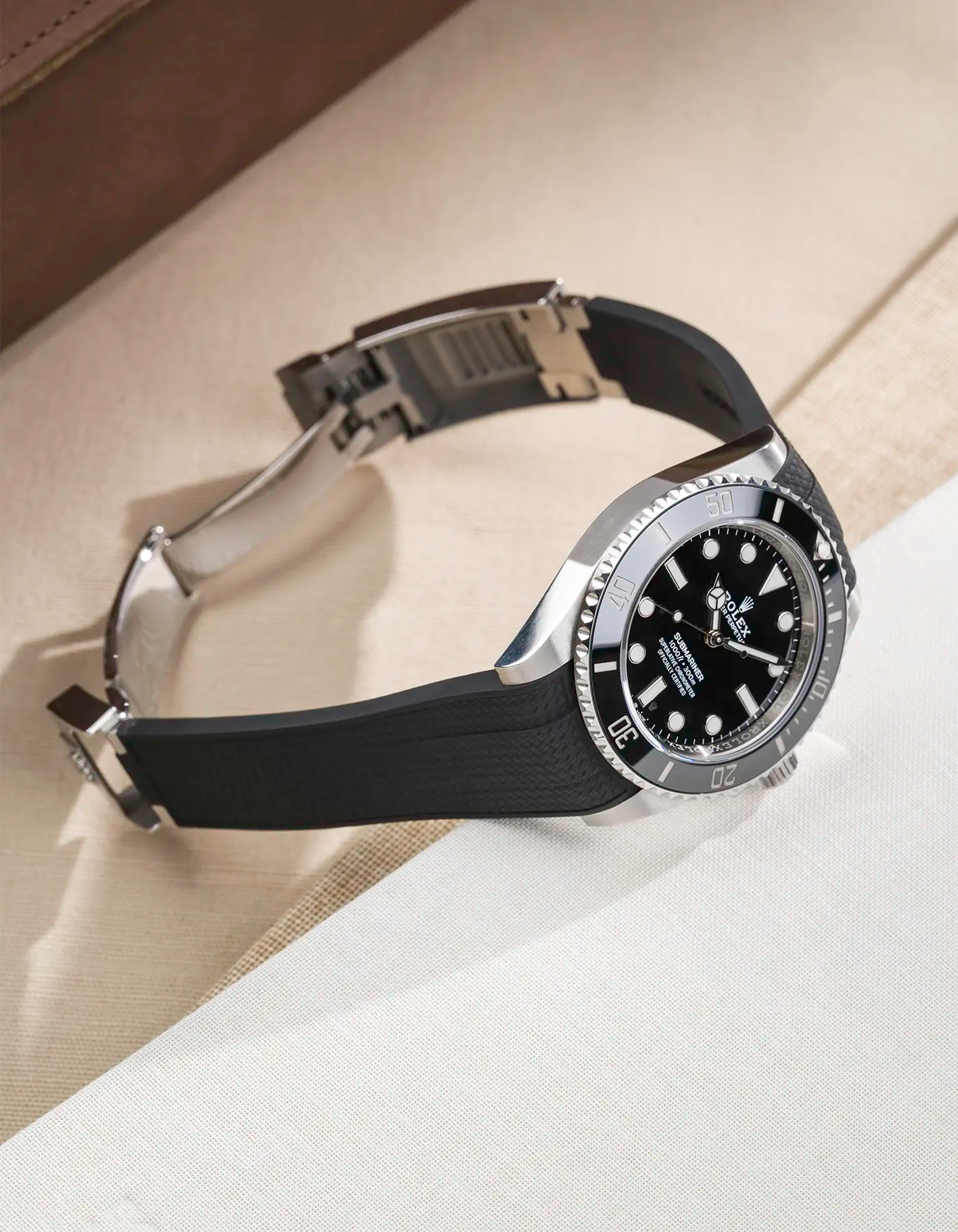 Rolex Submariner 41 with black Vertech FKM Rubber Strap sitting on the watch, integrated with original clasp – product photo side angle with clasp open