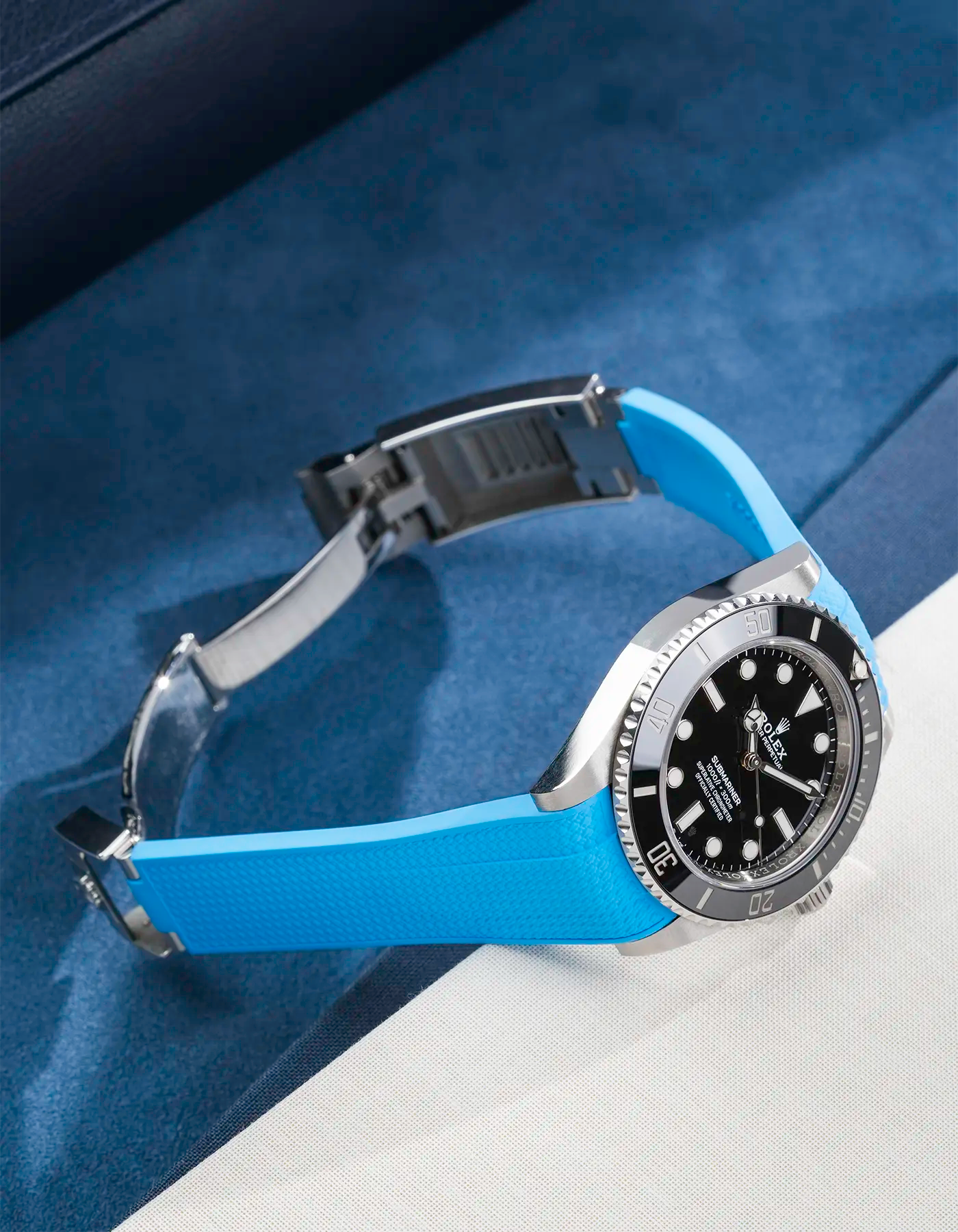 Product image of Rolex Submariner 41 ref. 126610LN/124060LN on Capri Blue Vertech FKM Rubber Strap – clasp open in angled side view