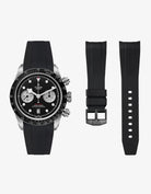 Black FKM tudor rubber watch strap with premium steel buckle on a light gray background and the tudor Chrono with black dial on the side