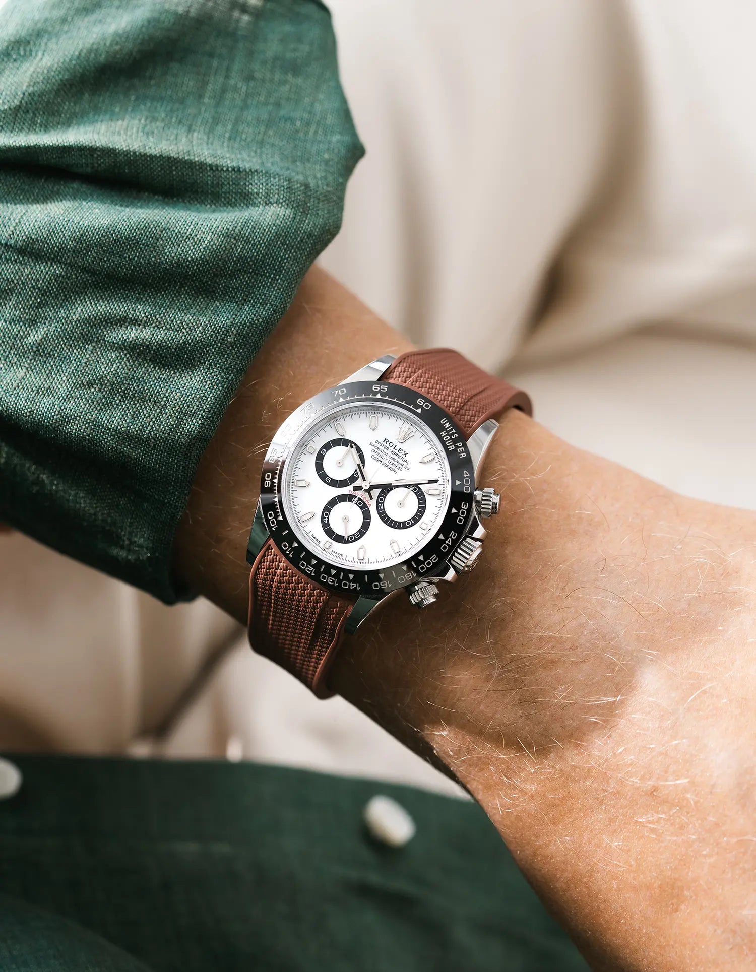 Vertech brown integrated FKM rubber strap with original clasp on Rolex Daytona 116500 black dial ceramic bezel wrist shot