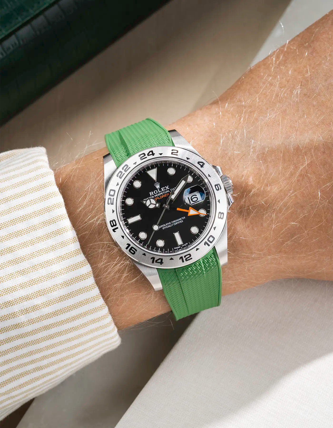 Wrist shot on A Green Vertech FKM Rubber Strap Integrated with Original Clasp - Rolex Explorer 216570 on beige background