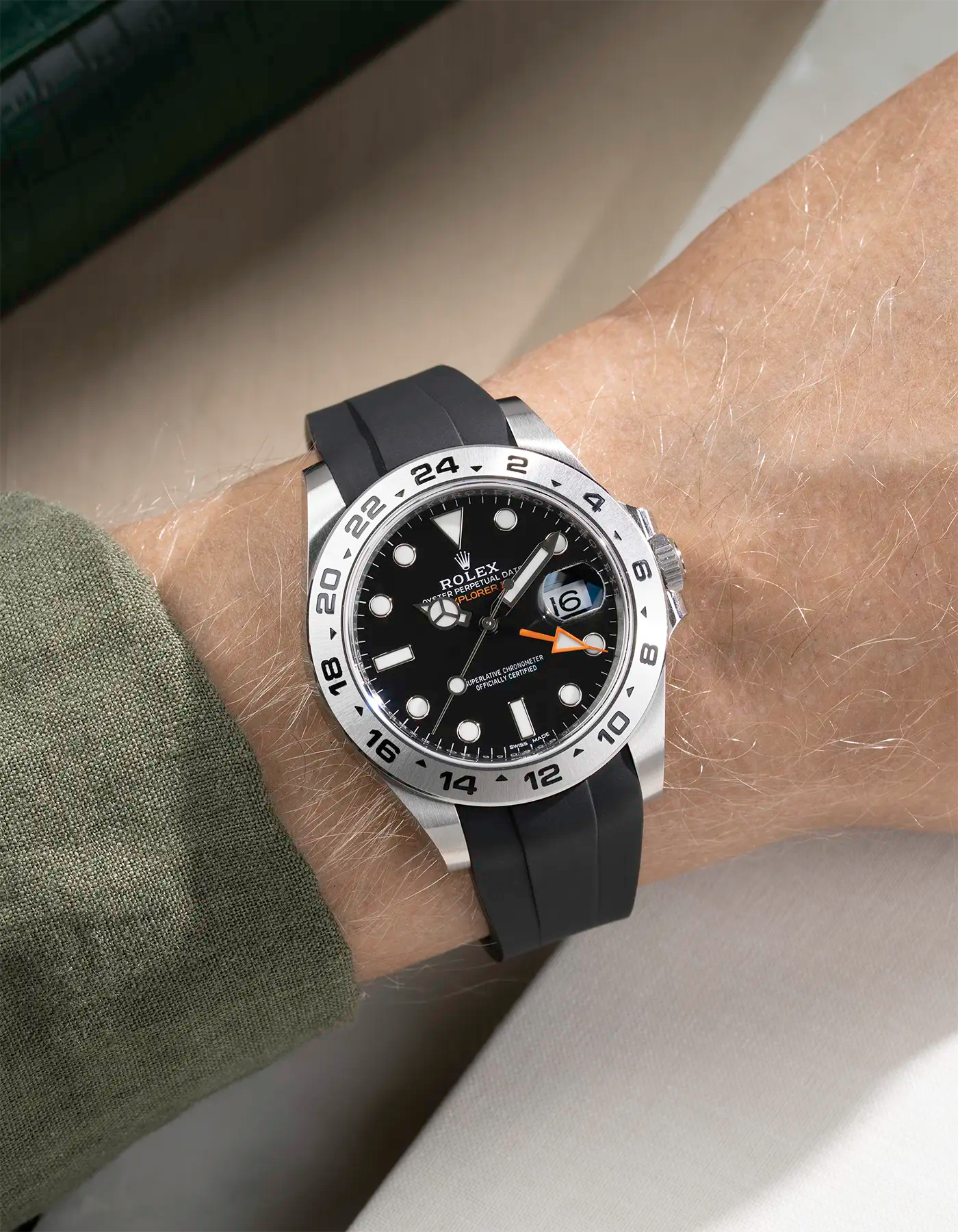 Wrist shot on black FKM Rubber Strap Integrated with Original Clasp - Rolex Explorer 216570 on beige background