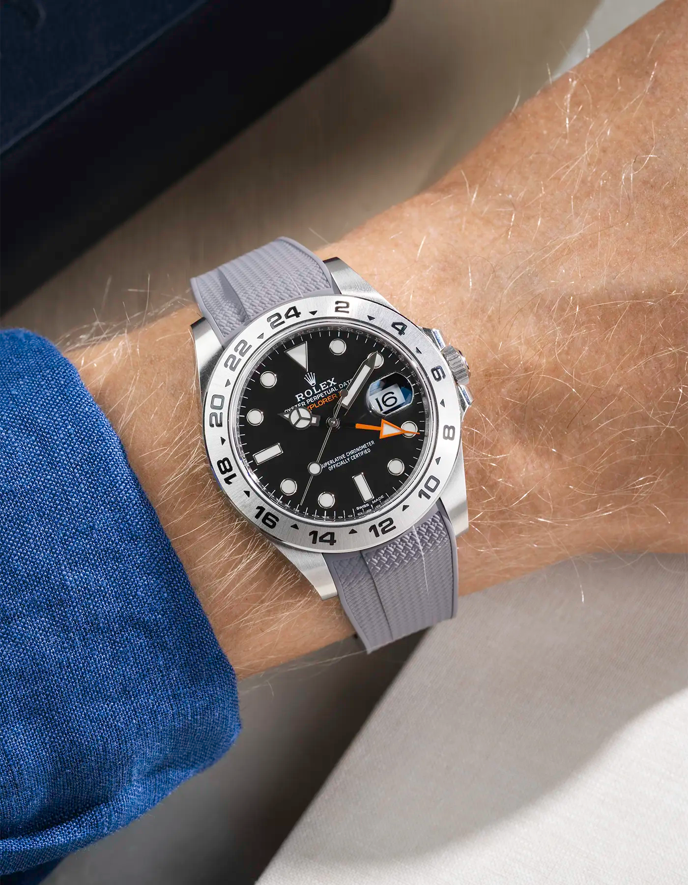 Wrist shot on Vertech FKM Rubber Strap in grey with Integrated Original Clasp - Rolex Explorer 216570 over a table