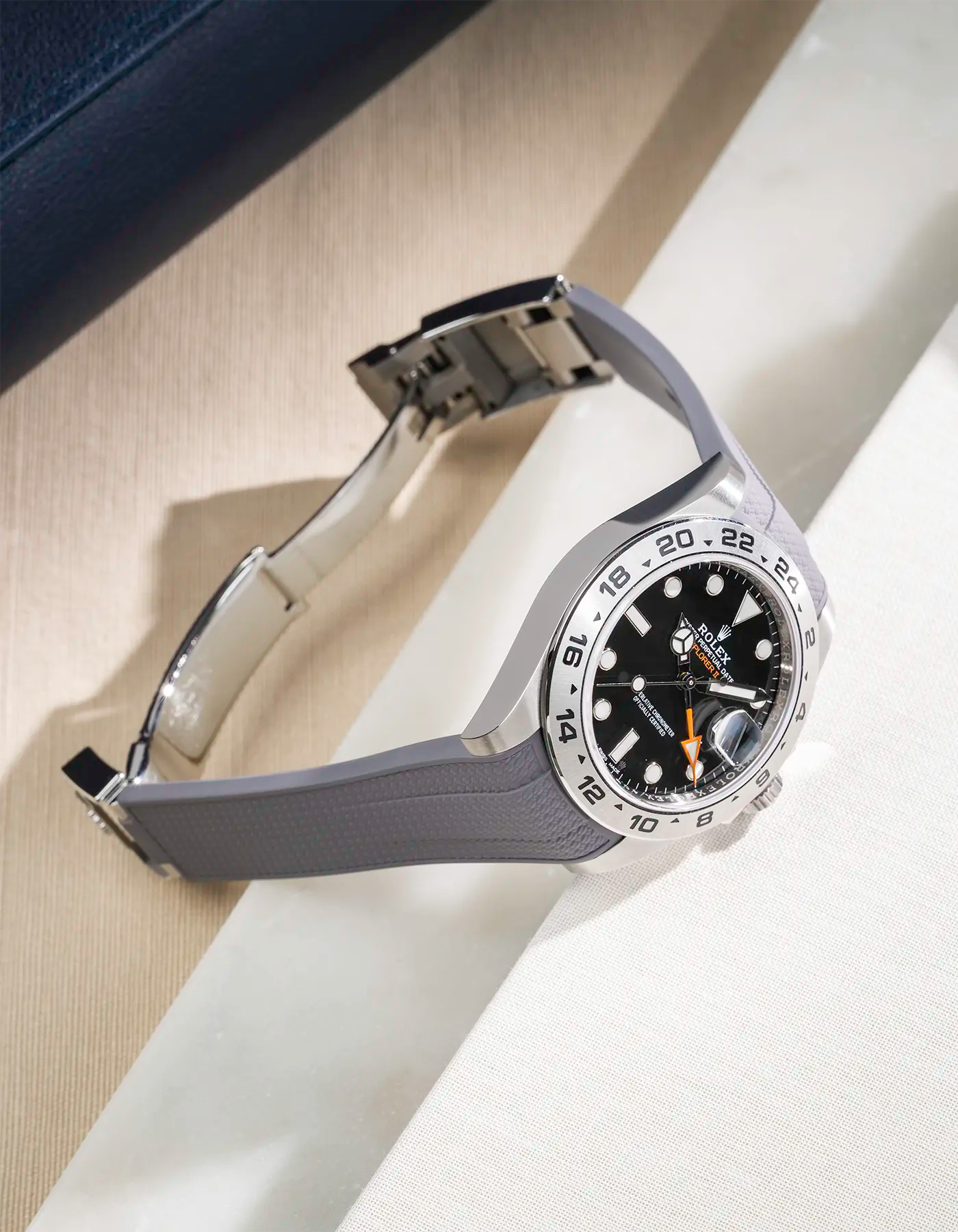 FKM rubber strap in Vertech integrated with original clasp for Rolex Explorer 216570 in grey, displayed on table with open clasp