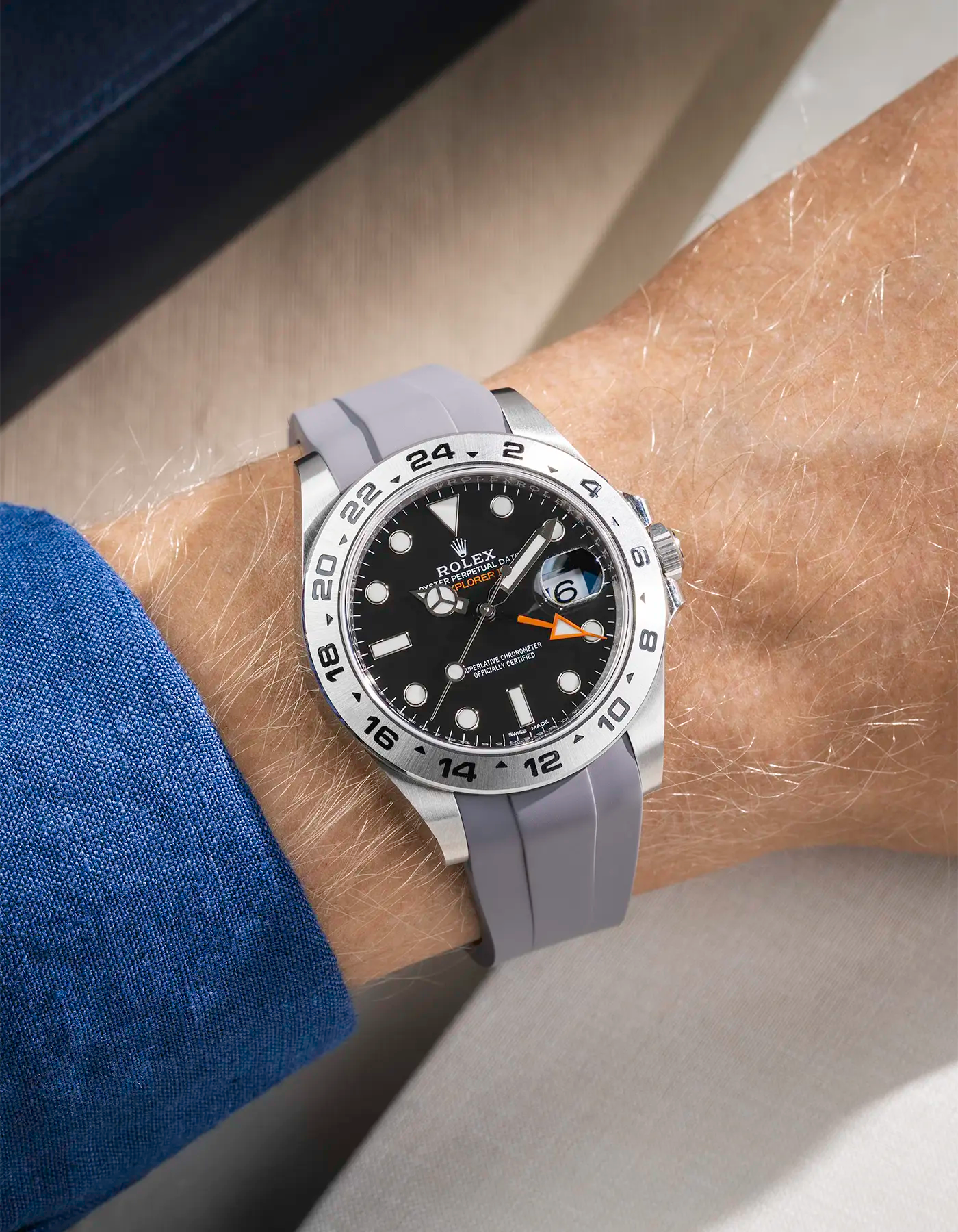 Wrist shot on grey FKM Rubber Strap Integrated with Original Clasp - Rolex Explorer 216570 on beige background