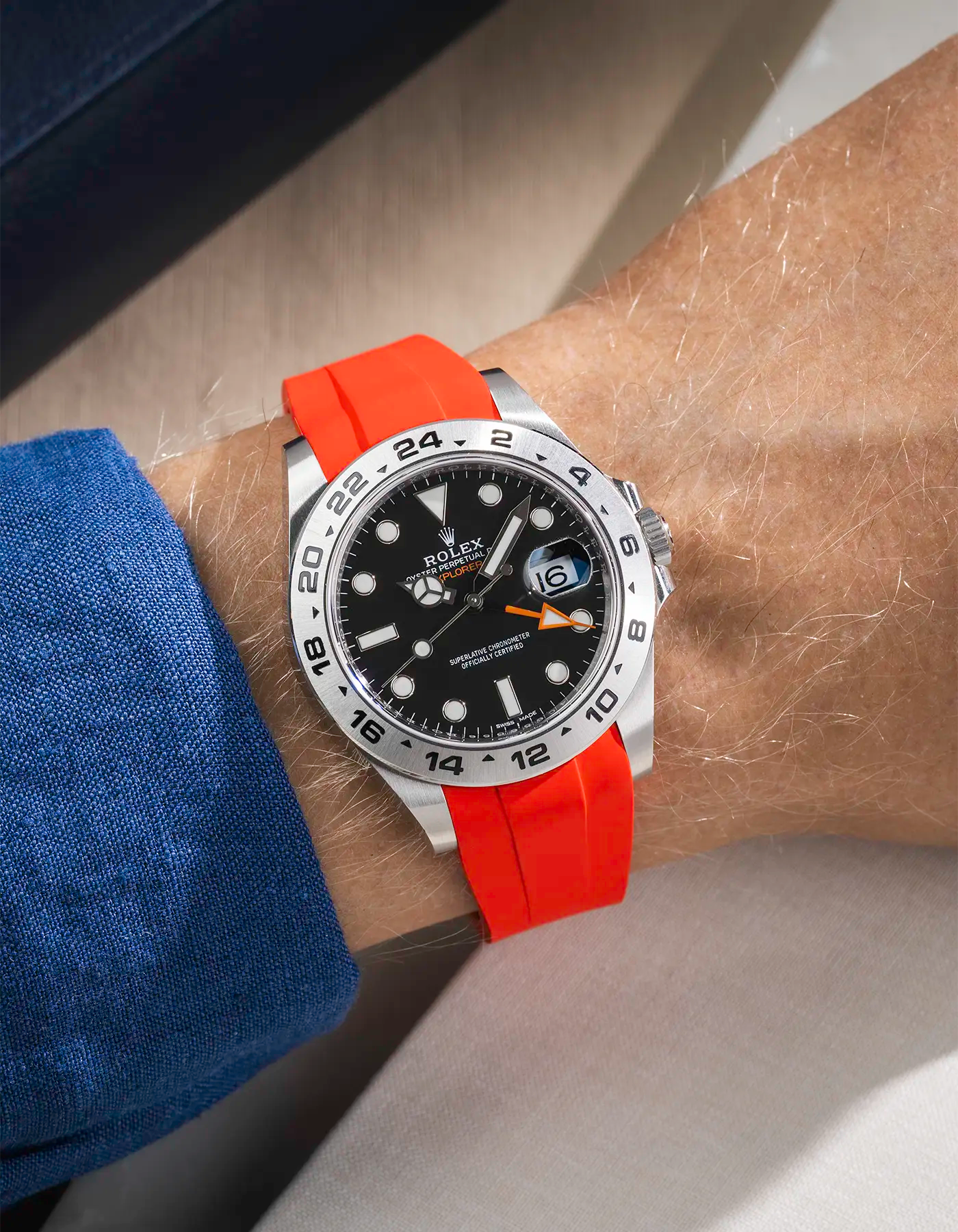 Wrist shot on Red FKM Rubber Strap Integrated with Original Clasp - Rolex Explorer 216570 on beige background