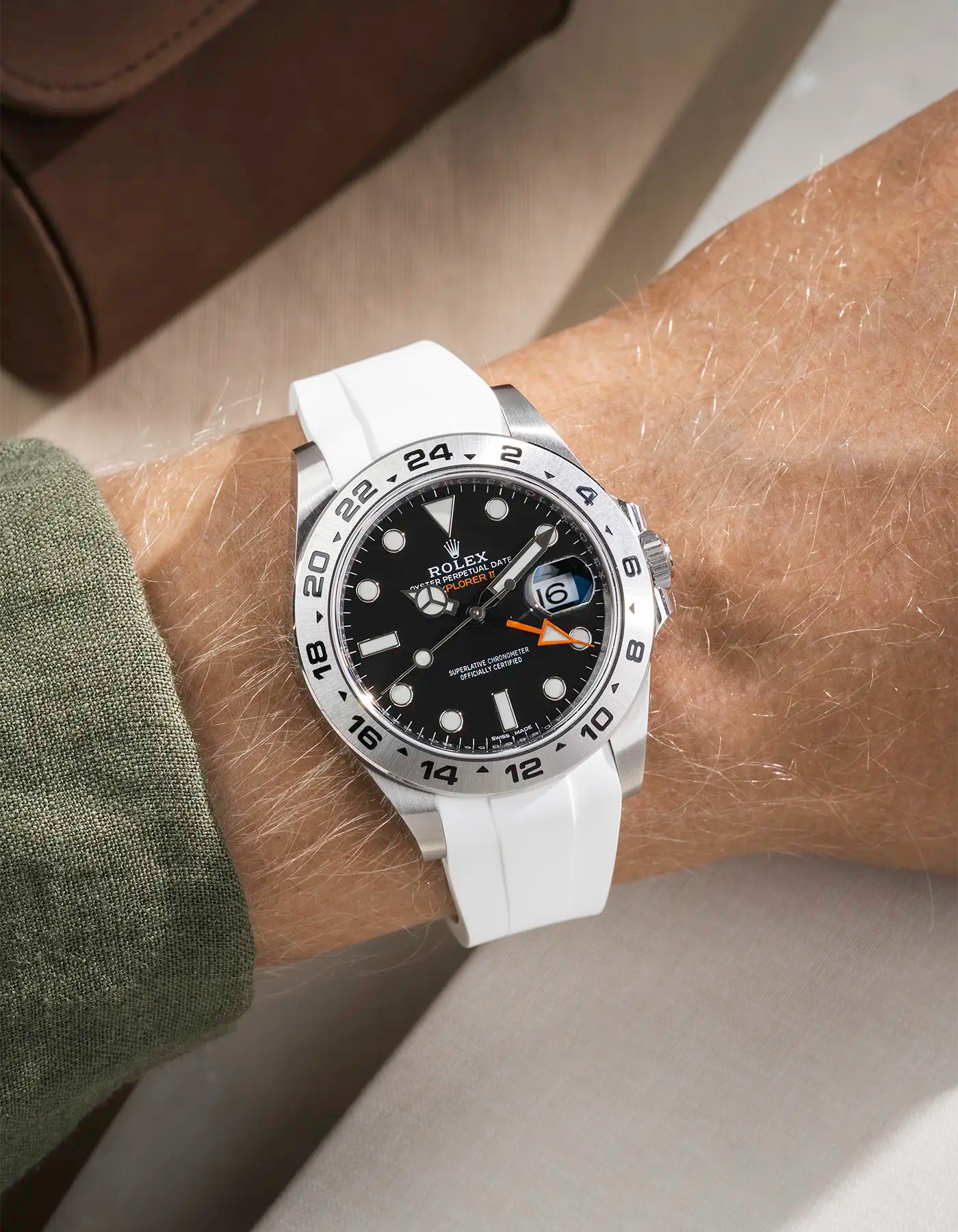 Wrist shot on White FKM Rubber Strap Integrated with Original Clasp - Rolex Explorer 216570 on beige background