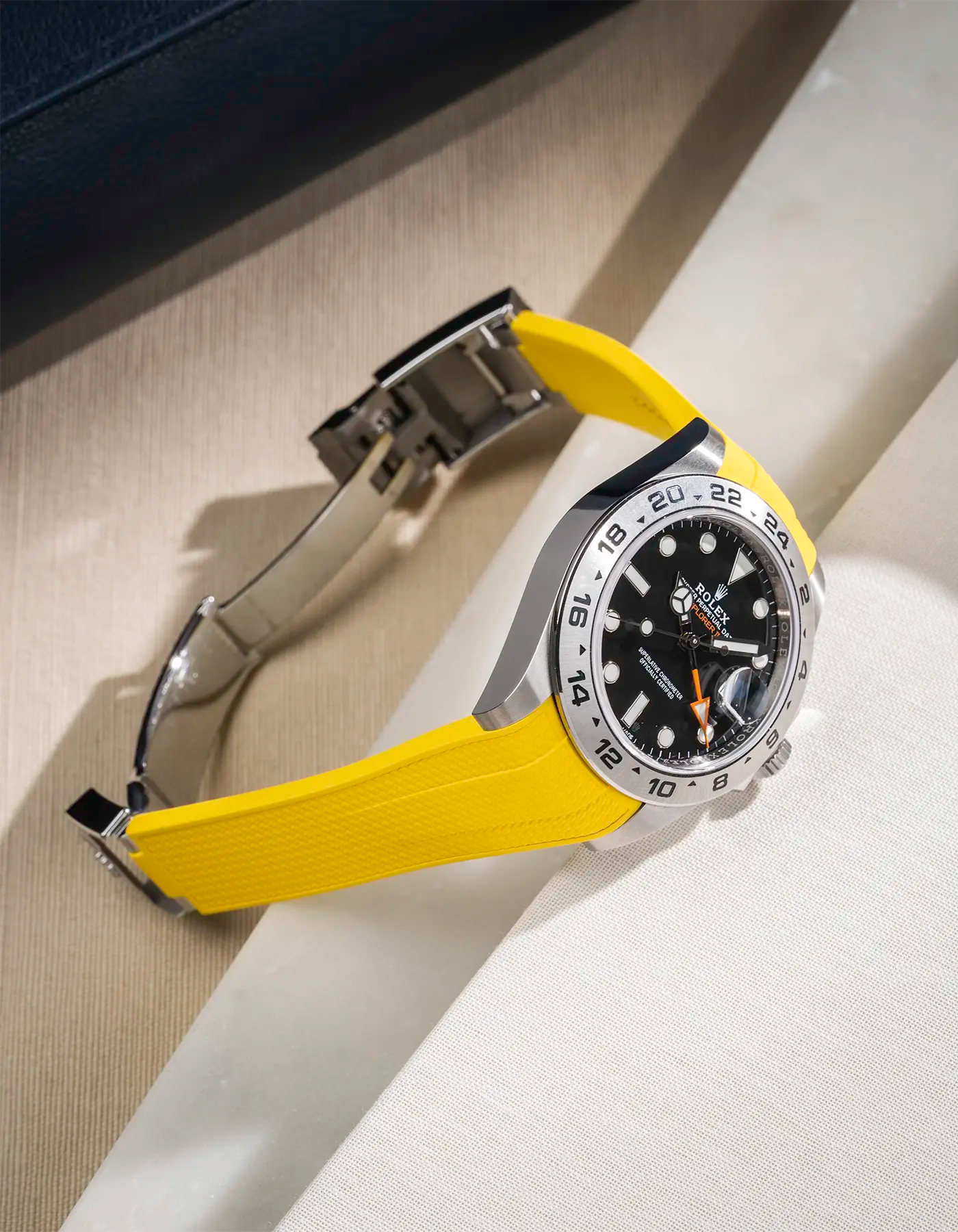 FKM rubber strap in Vertech integrated with original clasp for Rolex Explorer 216570 in yellow, displayed on table with open clasp