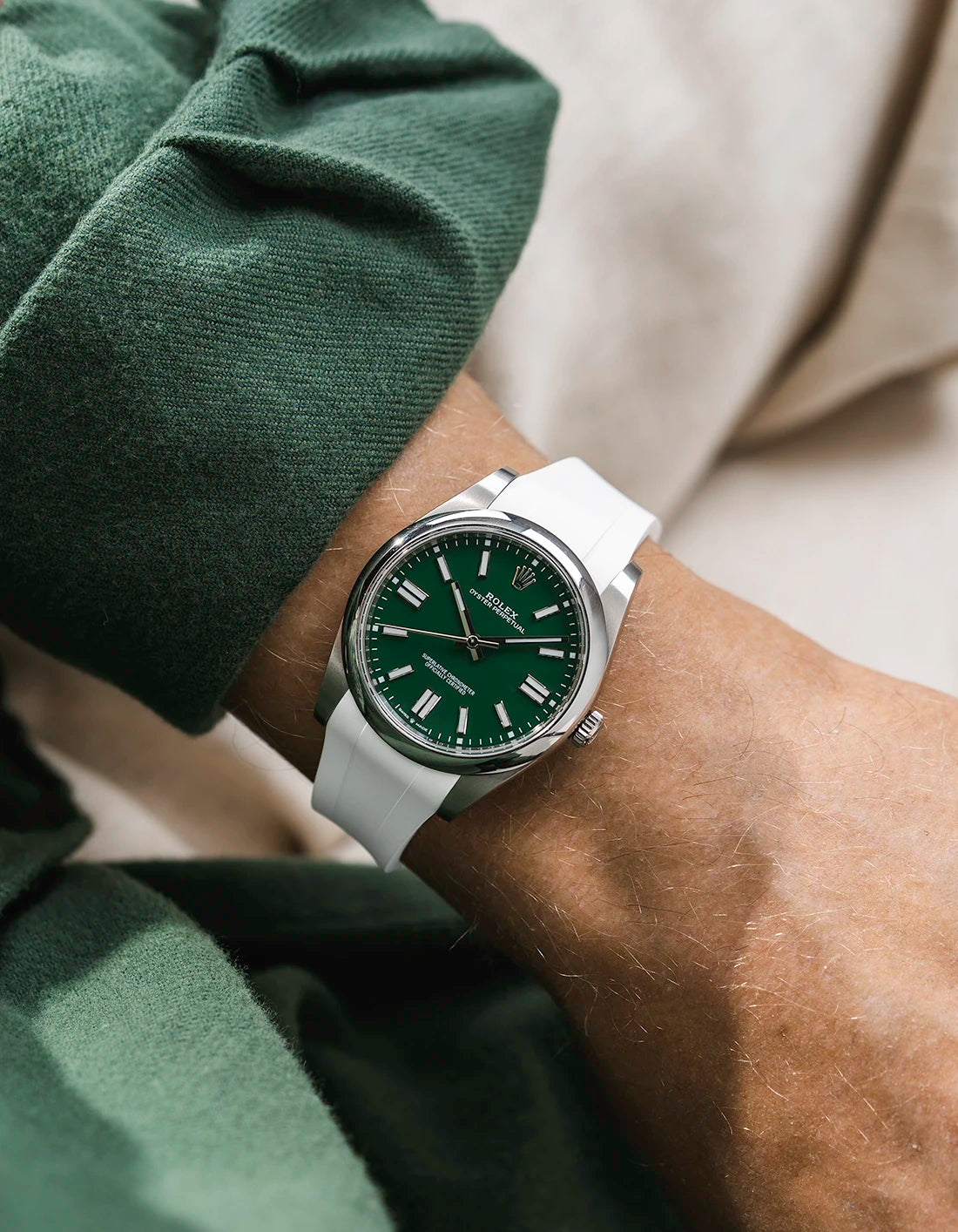 White integrated FKM rubber strap with original clasp on Rolex Oyster Perpetual 41 124300 green dial wrist shot