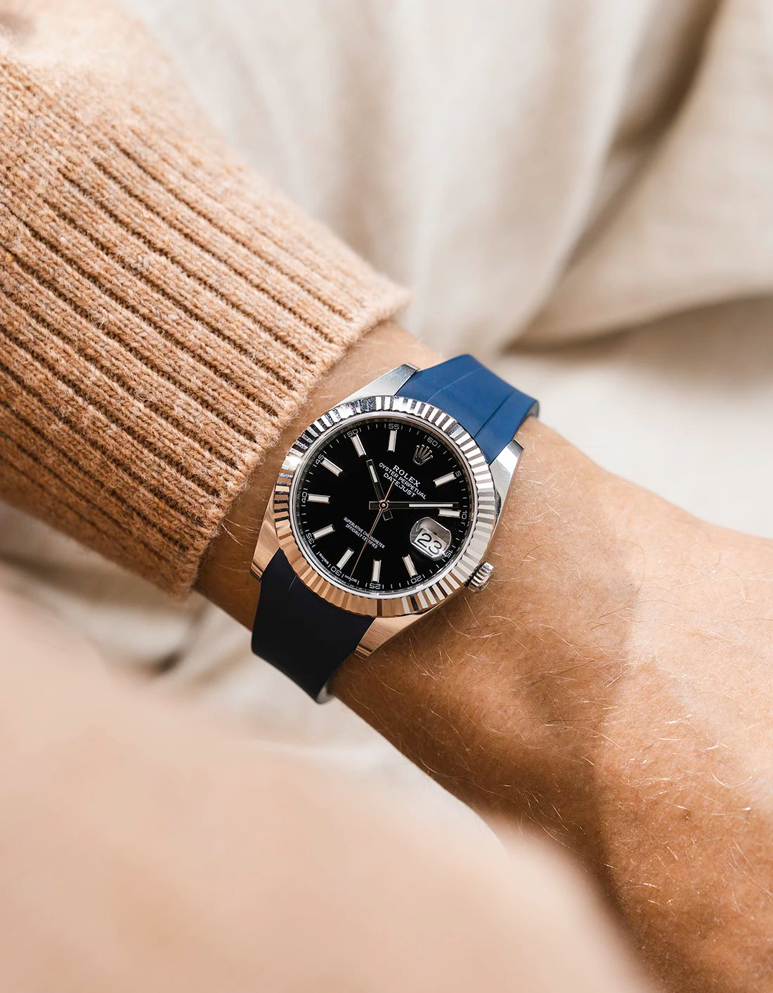 Navy blue integrated FKM rubber strap with original clasp on Rolex Datejust 41 126334 fluted bezel black dial wrist shot