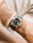 Green integrated FKM rubber strap with original clasp on Rolex Datejust 41 126300 smooth bezel grey dial wrist shot