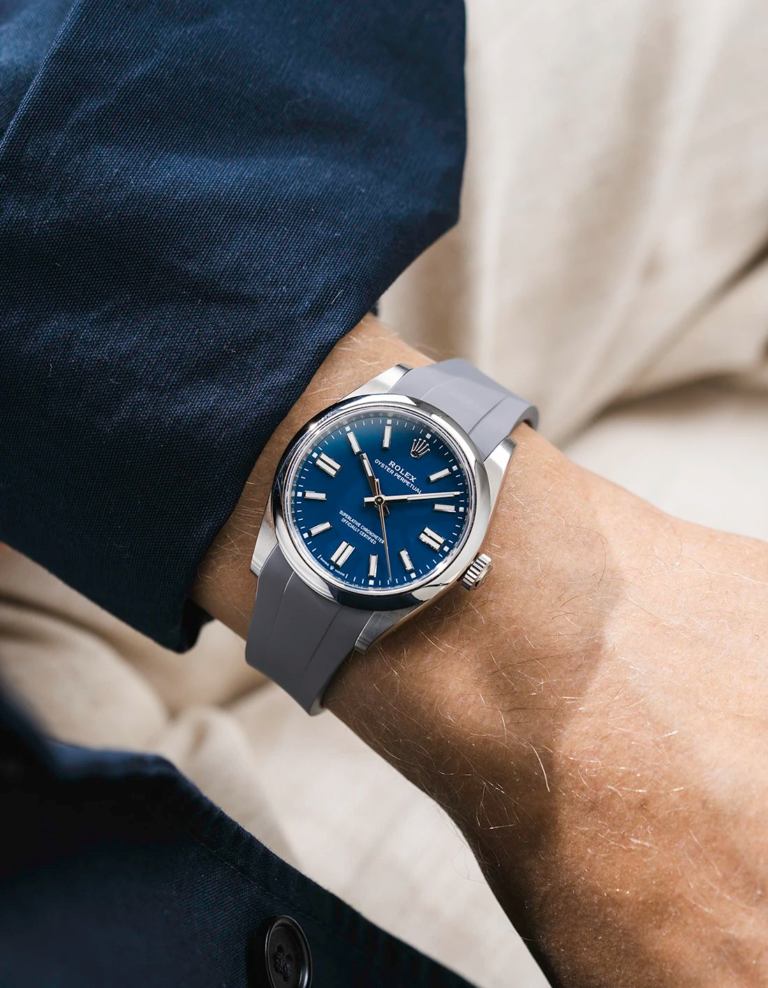 Grey integrated FKM rubber strap with original clasp on Rolex Oyster Perpetual 41 134300 blue dial wrist shot