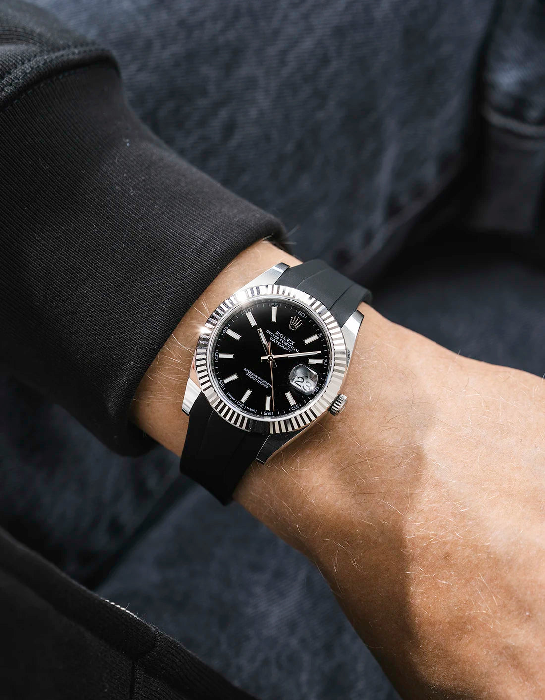 Black integrated FKM rubber strap with original clasp on Rolex Datejust 41 126334 fluted bezel black dial wrist shot