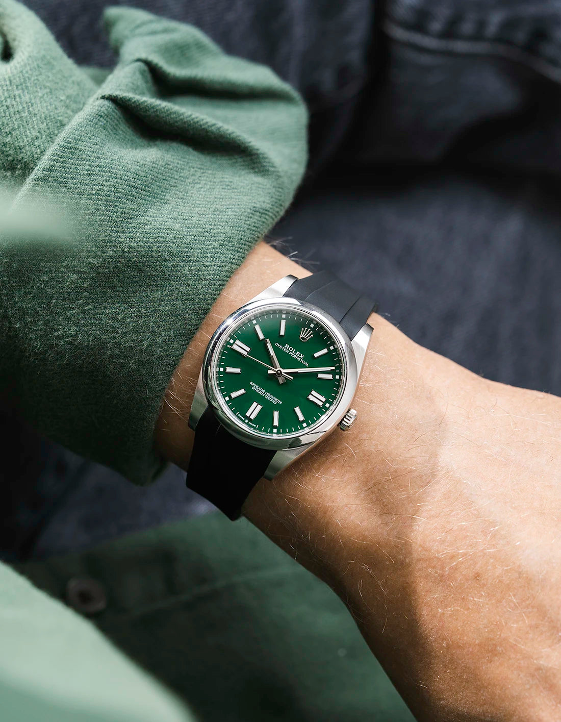 Black integrated FKM rubber strap with original clasp on Rolex Oyster Perpetual 41 124300 green dial wrist shot