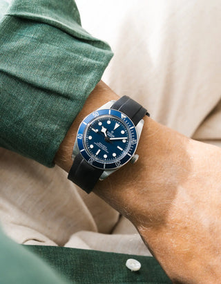 Wristbuddys  black rubber strap on Tudor Black Bay 58 Navy Blue — wrist lifestyle shot with green shirt