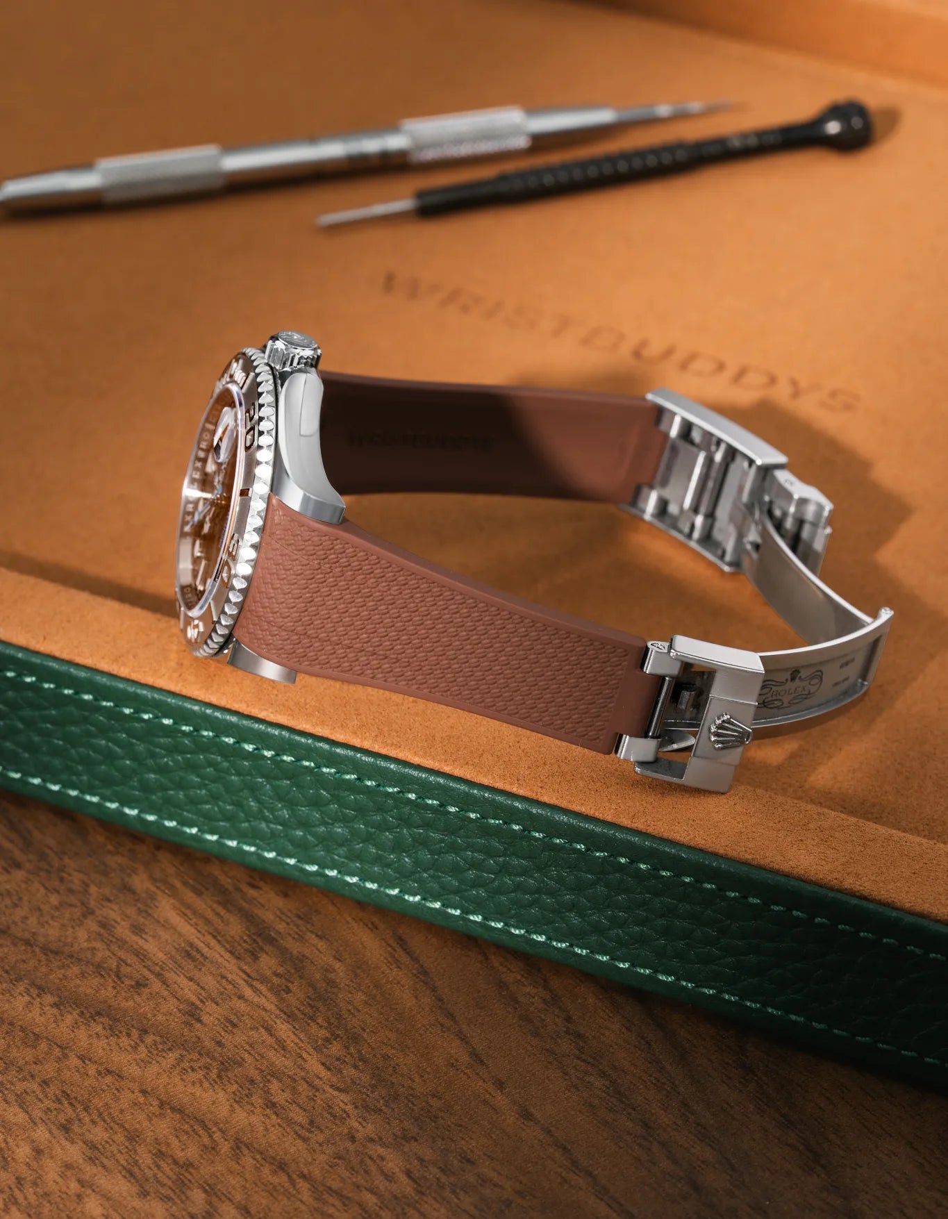 Brown textured FKM rubber watch band for Rolex Yacht-Master 116622 & 126622, premium integrated design for original clasp, shown on a brown leather tray.