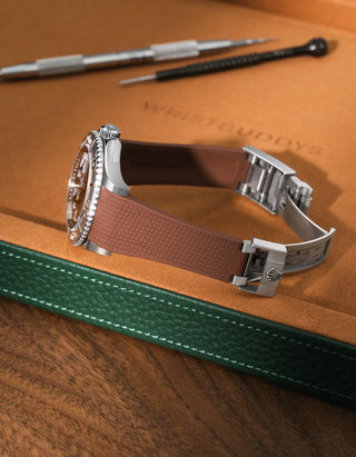 Brown textured FKM rubber watch band for Rolex Yacht-Master 116622 & 126622, premium integrated design for original clasp, shown on a brown leather tray.