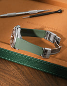 Military Green FKM rubber strap for Rolex Yacht-Master 116622 and 126622, integrated case fit for original clasp, resting on a leather watch tray.