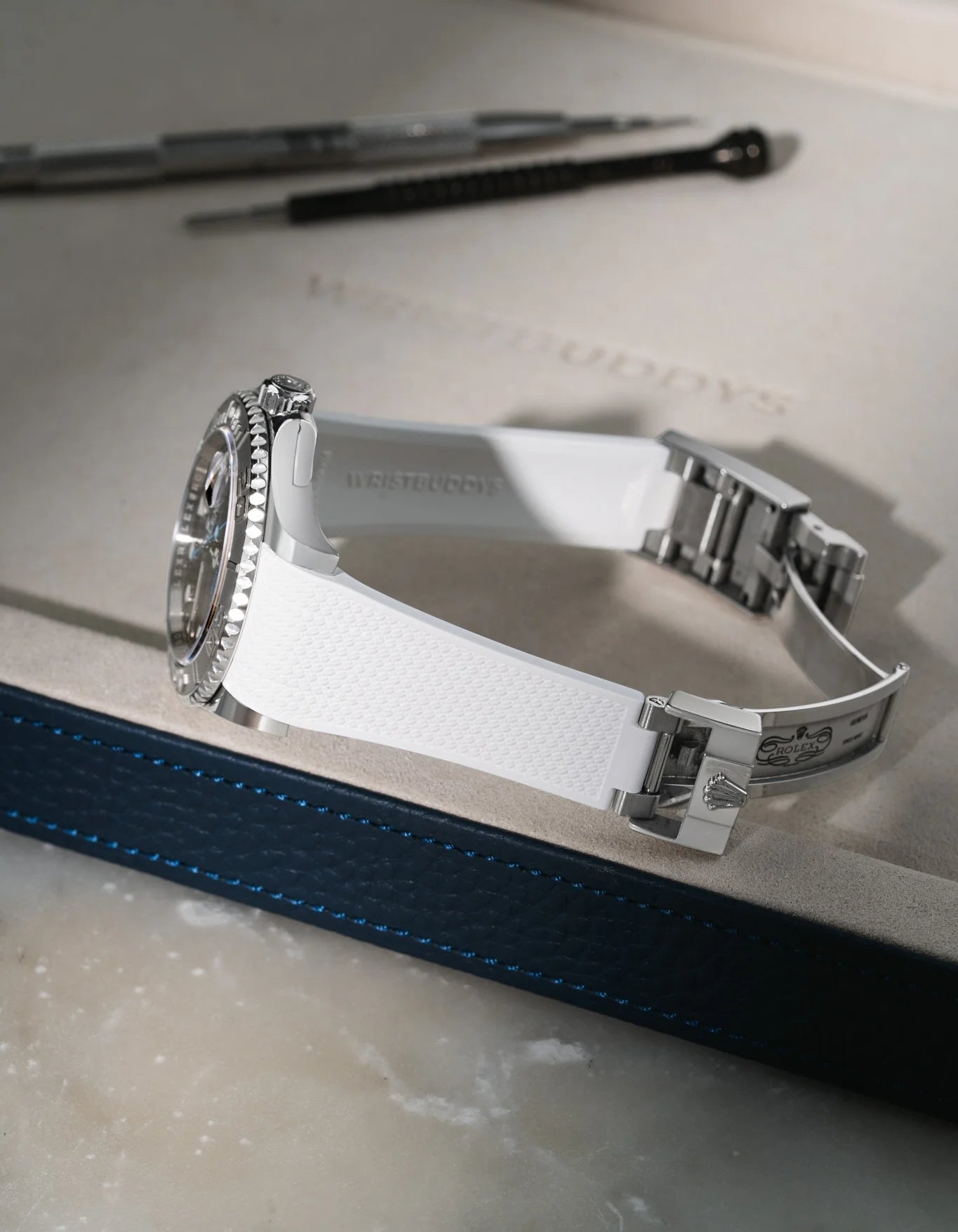 White Vertech FKM rubber strap for Rolex Yacht-Master 116622 and 126622, custom integrated fit for original clasp, resting on a white leather tray.
