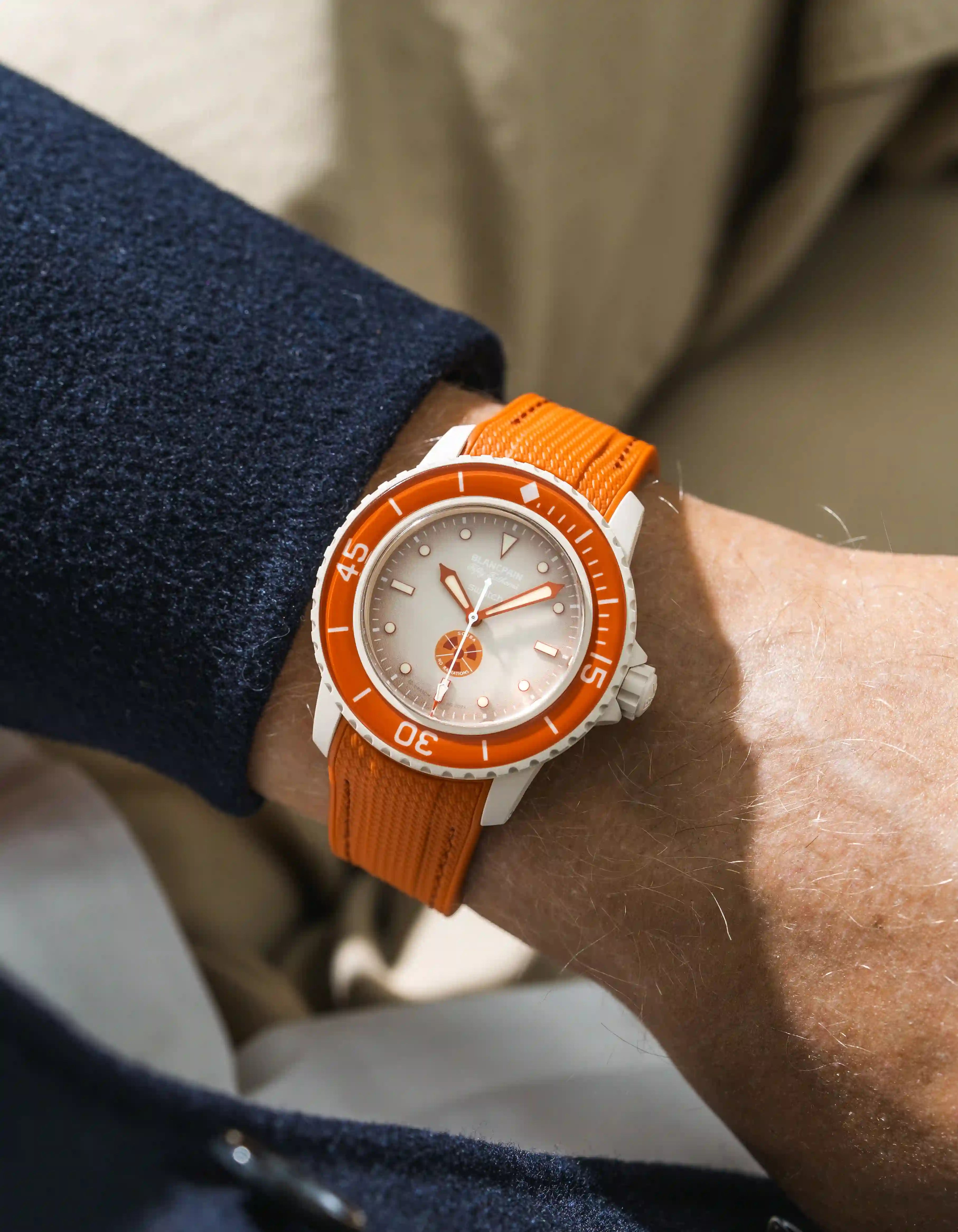 Arctic Red Rubber Strap on Blancpain X Swatch Arctic Ocean wrist shot with blue shirt