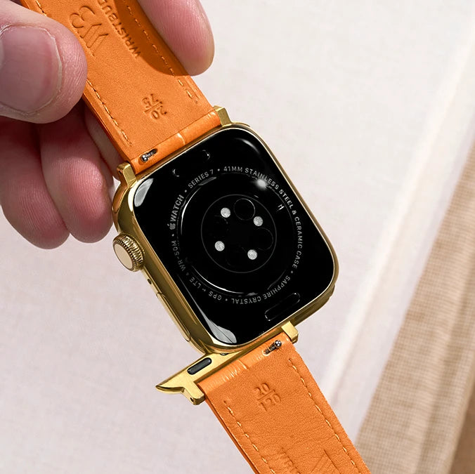 Bands for Apple Watch – gold case with orange leather strap featuring easy-swap adapter