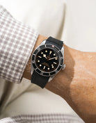 Black FKM rubber watch strap from Wristbuddys with a Tudor BB41 Heritage black dial on a person's wrist