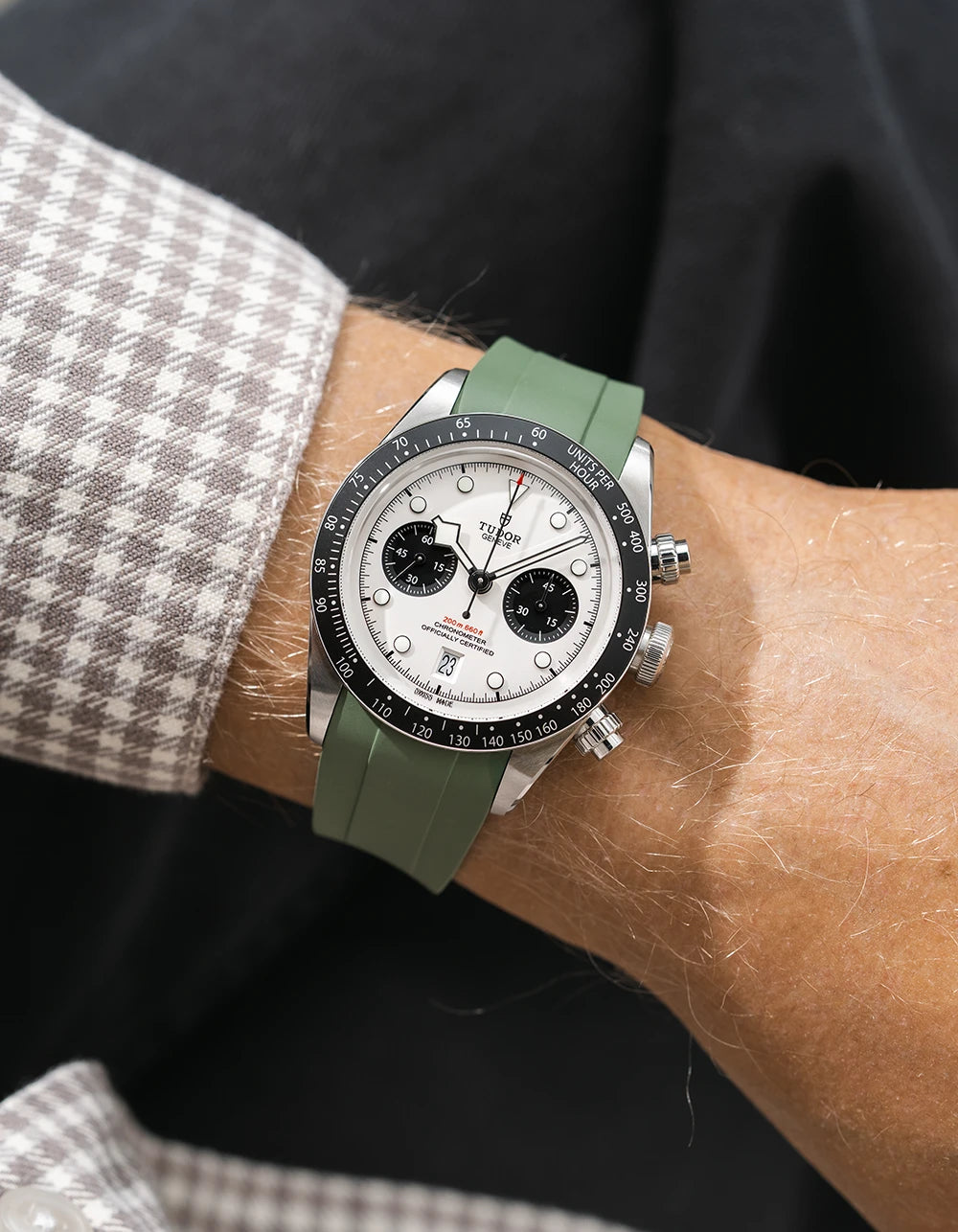 green FKM rubber watch strap from Wristbuddys with a Tudor Chrono white dial on a person's wrist