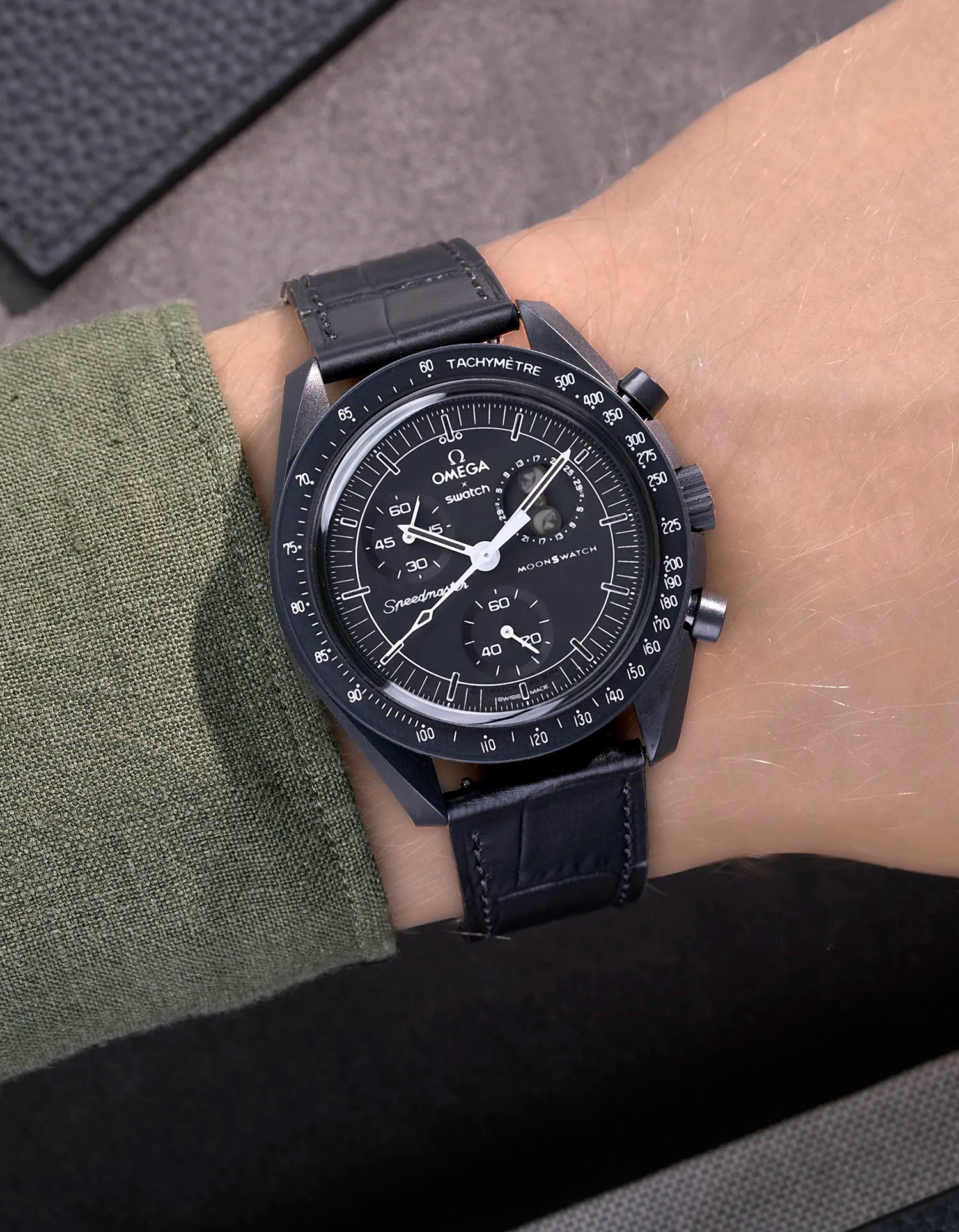 Black embossed alligator leather strap on Omega X Swatch MoonSwatch Mission to the Moonphase New Moon – wrist shot