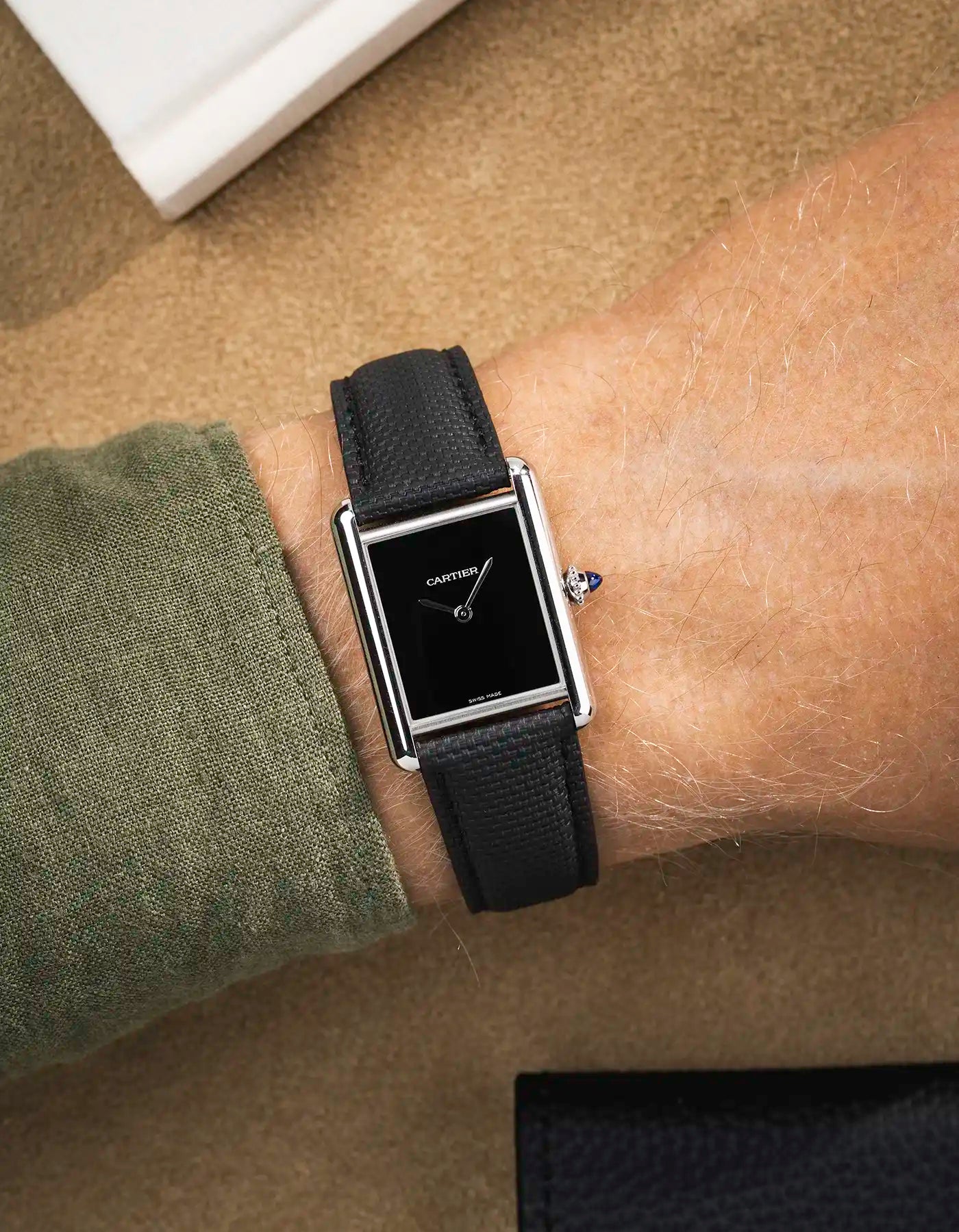 Black rubberised sailcloth strap on Cartier Tank Must with black dial – sleek look for formal watches