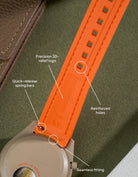 Orange curved rubber watch strap with seamless case fit, precision 3D logo, reinforced buckle holes and quick-release spring bars