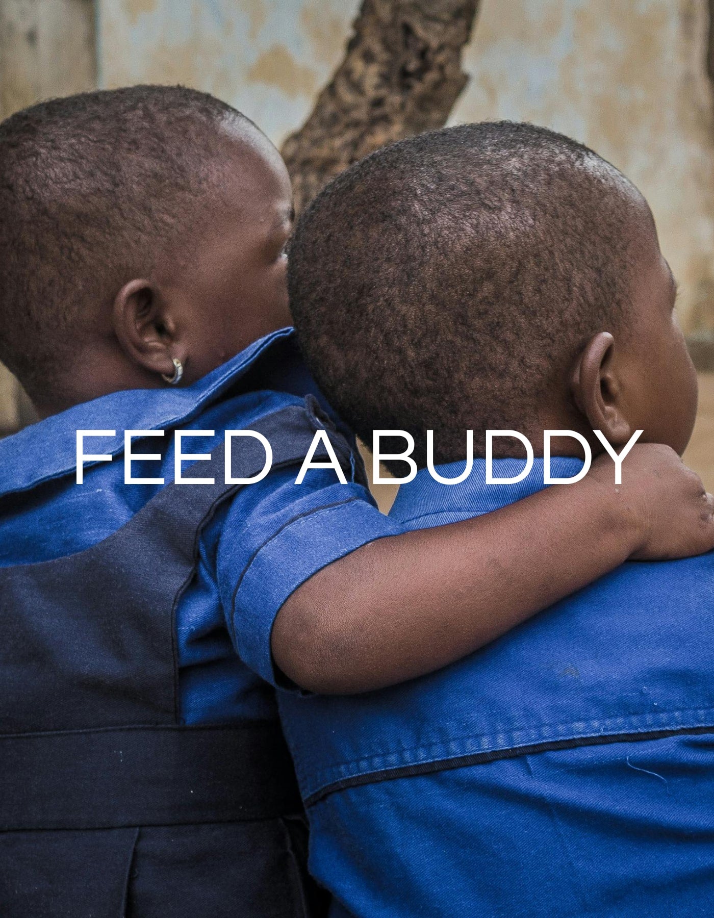 Feed a buddy donation with two kids hugging each other