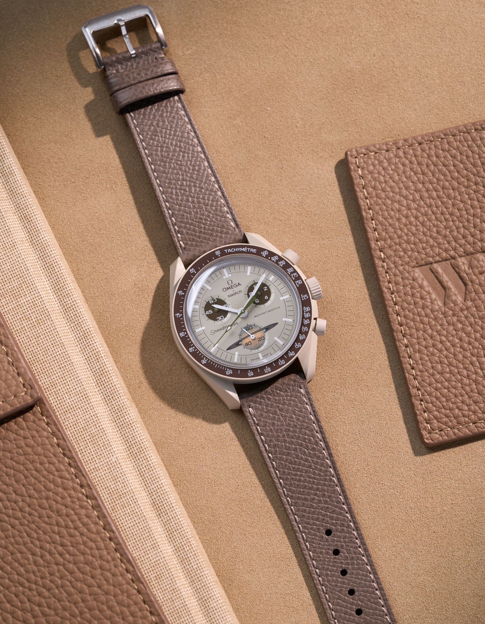 Flat lay of grey Epsom leather strap for Omega x Swatch MoonSwatch Mission to Saturn