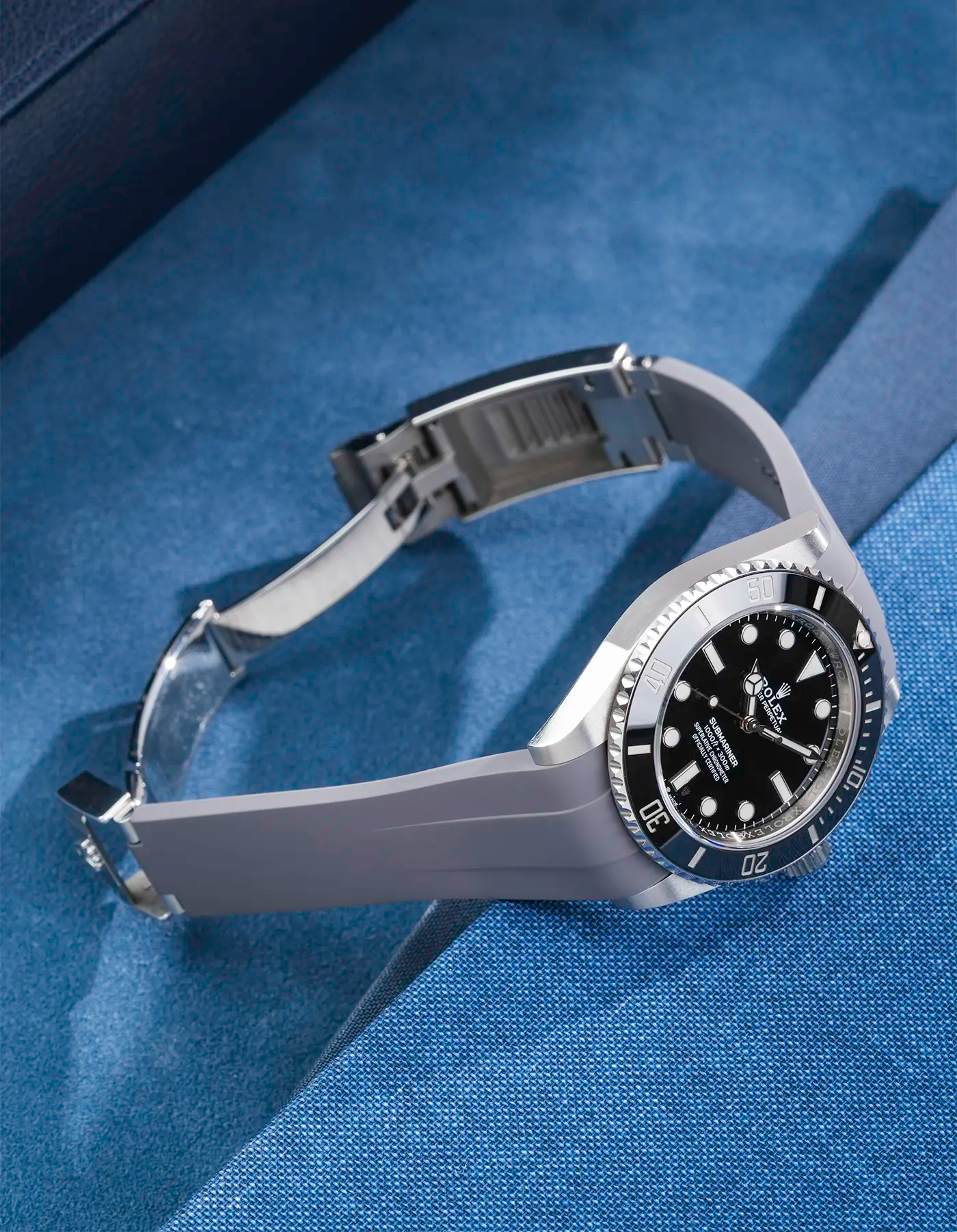 Rolex Submariner 41 fitted with grey Classic Smooth FKM Rubber Strap sitting on the watch, integrated with original clasp – side angle product photo showing clasp open