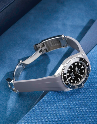Rolex Submariner 41 fitted with grey Classic Smooth FKM Rubber Strap sitting on the watch, integrated with original clasp – side angle product photo showing clasp open