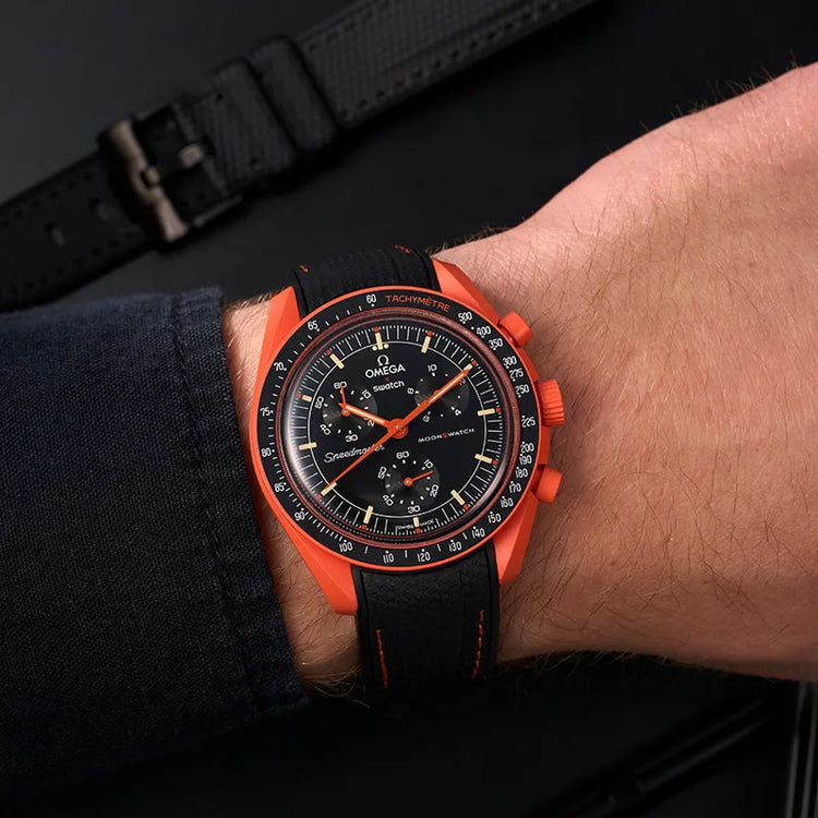 Omega X Swatch MoonSwatch Mission with a premium orange rubber strap from wristbuddys.com, combining style and durability.