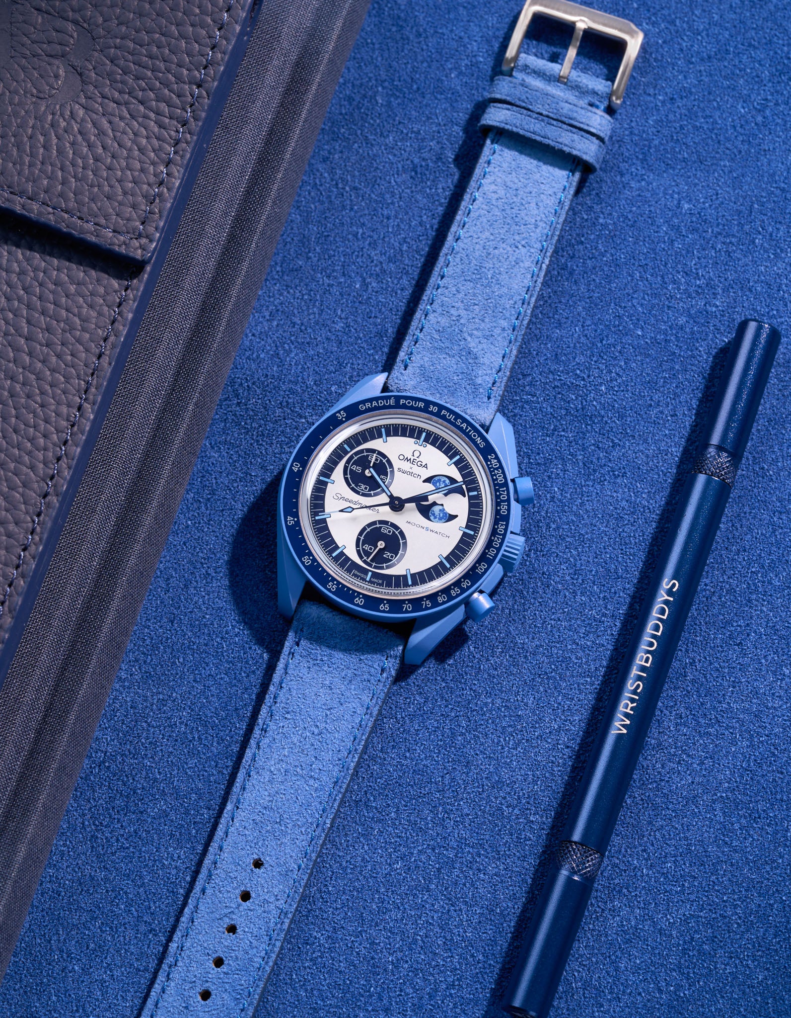 Flat lay of Ocean Blue suede leather strap for Omega X Swatch Super Blue Moonphase