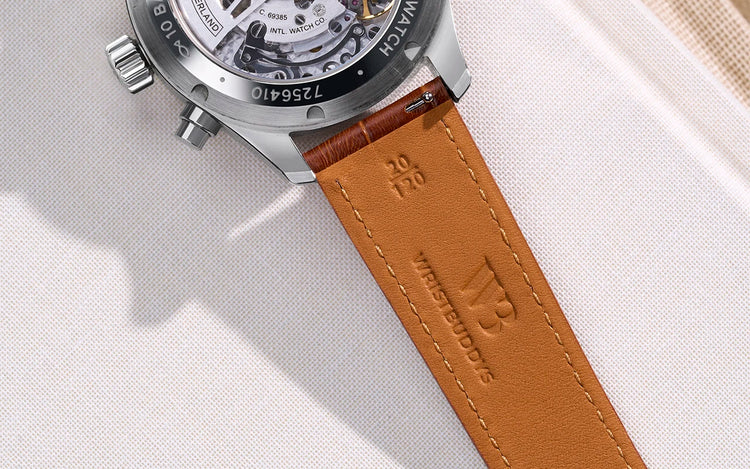 Close-up of a Wristbuddys leather watch strap showing the soft inner lining and embossed logo.