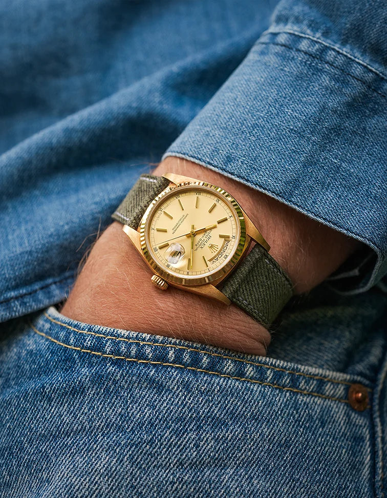 Military Green Denim Strap on gold Rolex Datejust – wrist shot styled with denim shirt