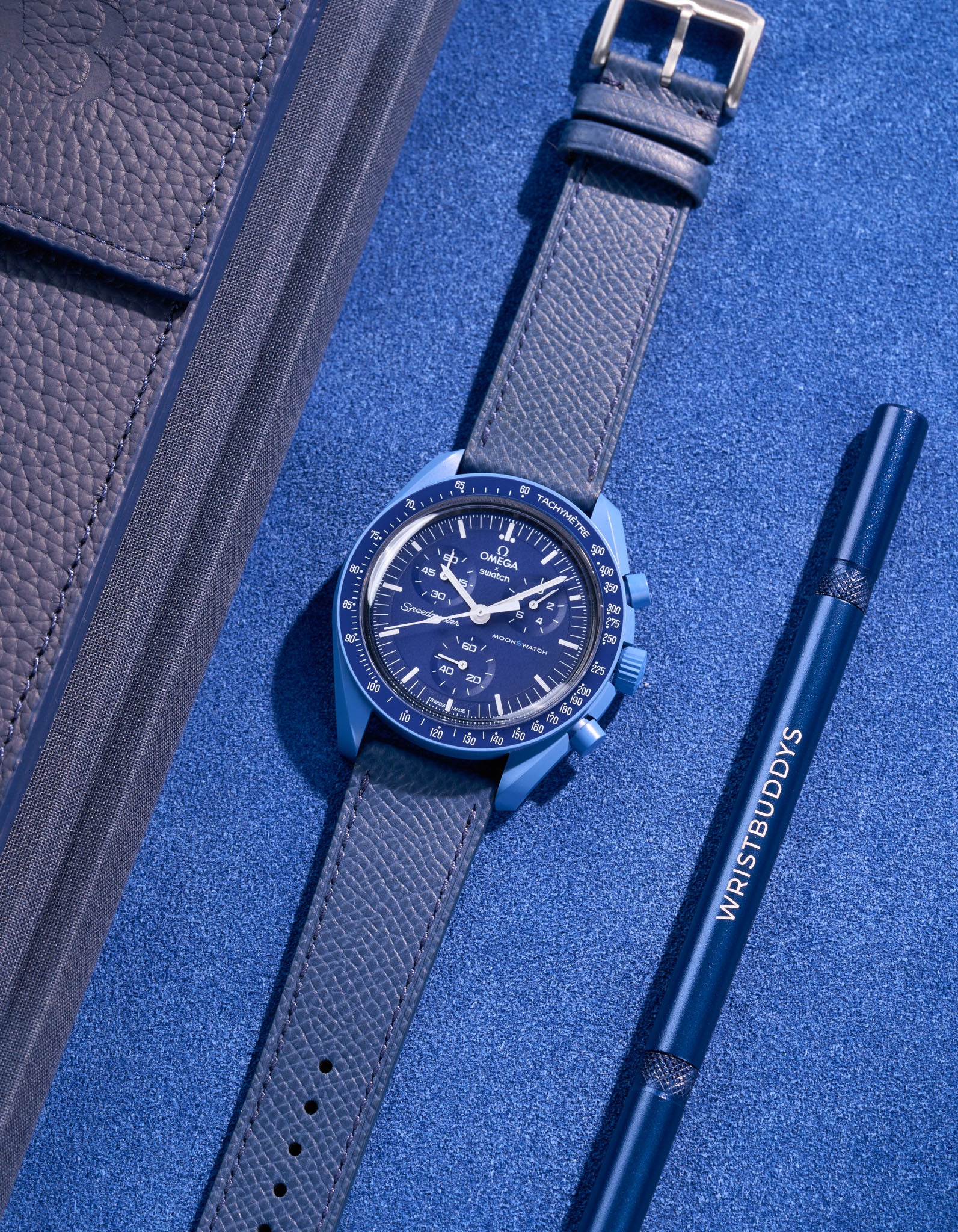 Flat lay of Navy Blue Epsom leather strap for Omega x Swatch MoonSwatch Neptune