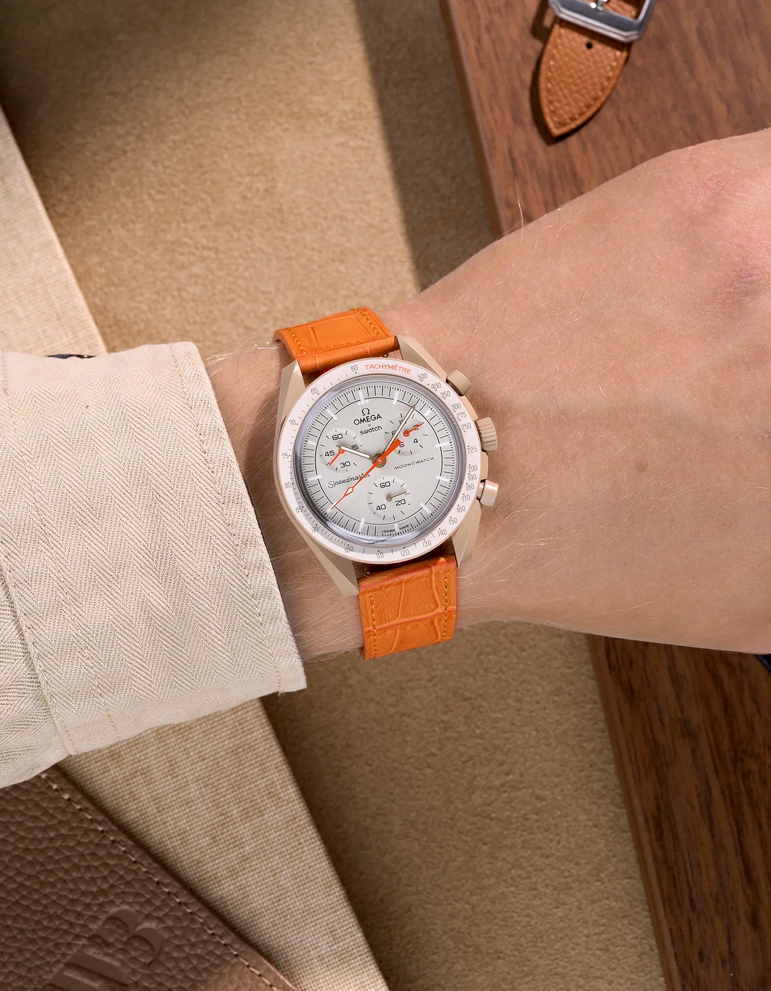 Orange embossed alligator leather strap on Omega X Swatch MoonSwatch Mission to Jupiter – wrist shot