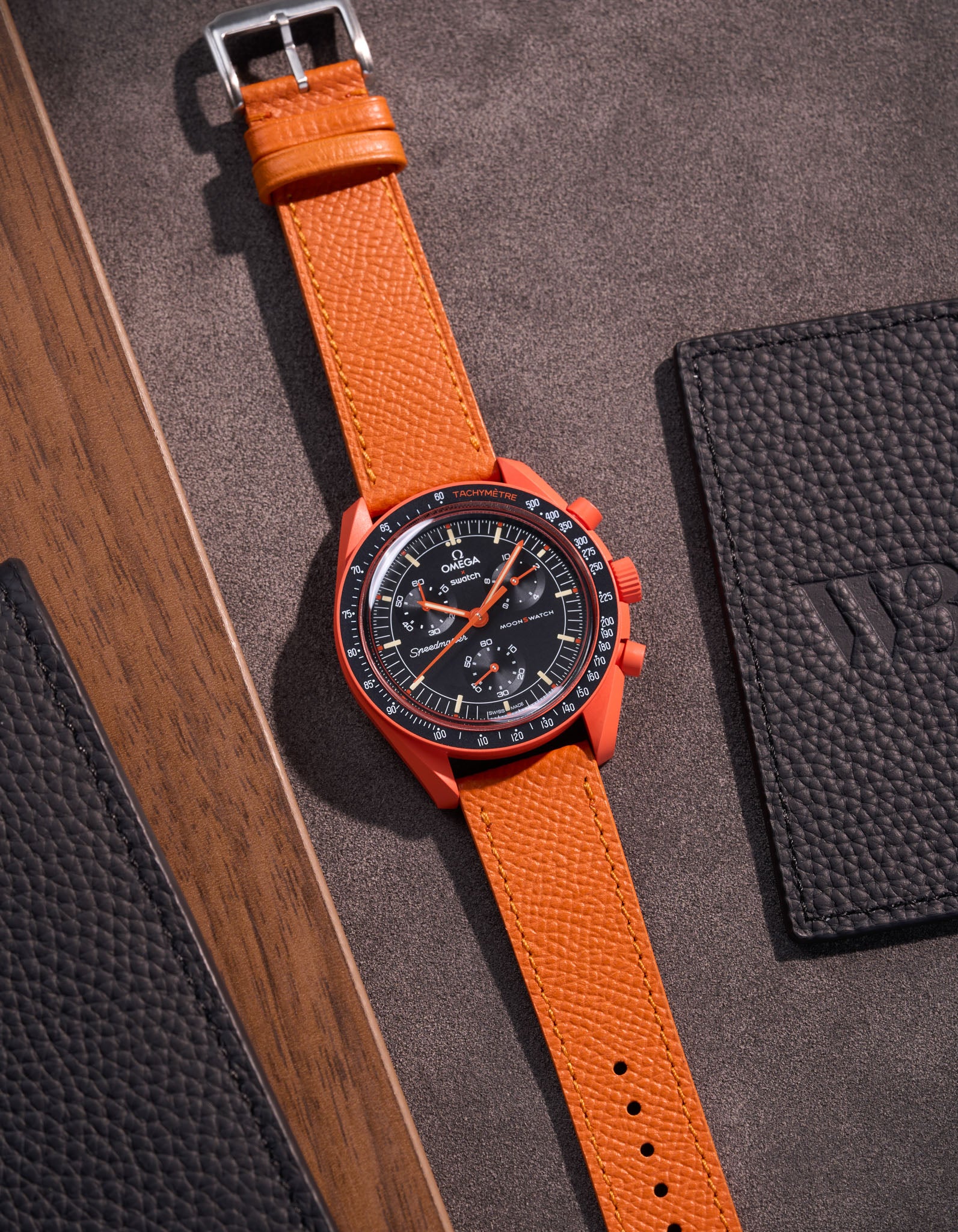 Flat lay of Orange Epsom leather strap for Omega x Swatch MoonSwatch mission on Earth Lava