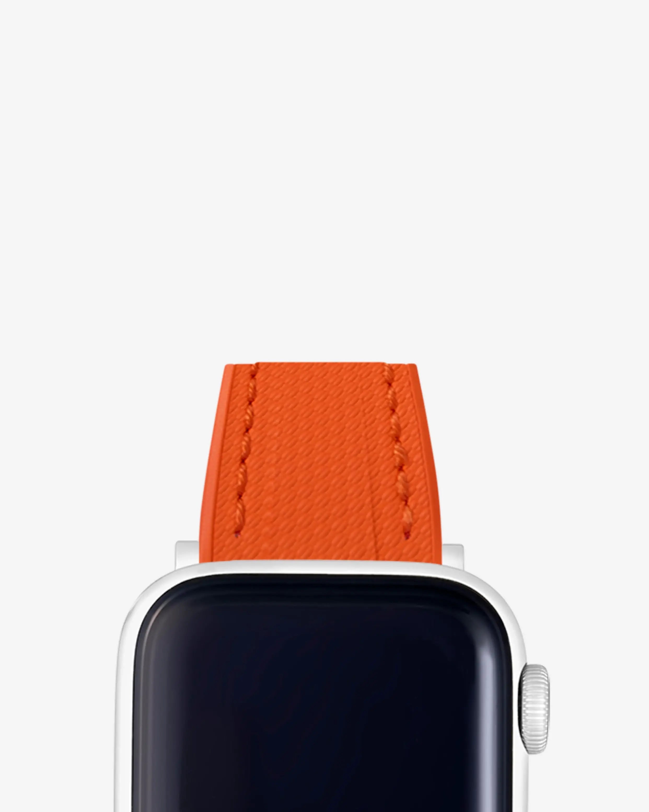 Bright orange rubber Apple Watch strap attached to a silver Apple Watch. Browse our collection of premium Apple Watch bands – perfect for all models.