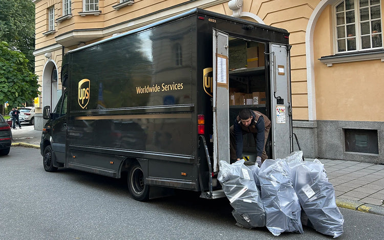 UPS truck loading Wristbuddys rubber strap shipments from Stockholm warehouse for global delivery to customers
