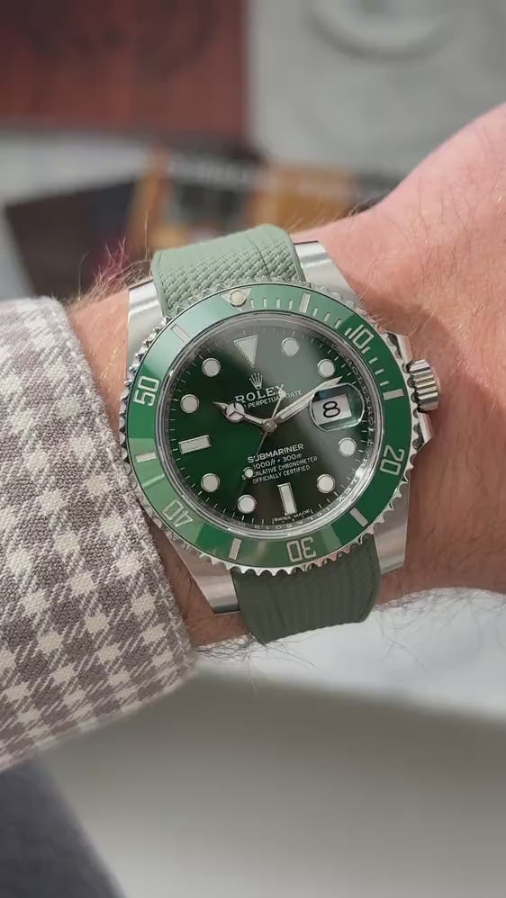 Short UGC clip showing a wrist roll of a  Rolex Submariner 116610LV with green vertech rubber strap