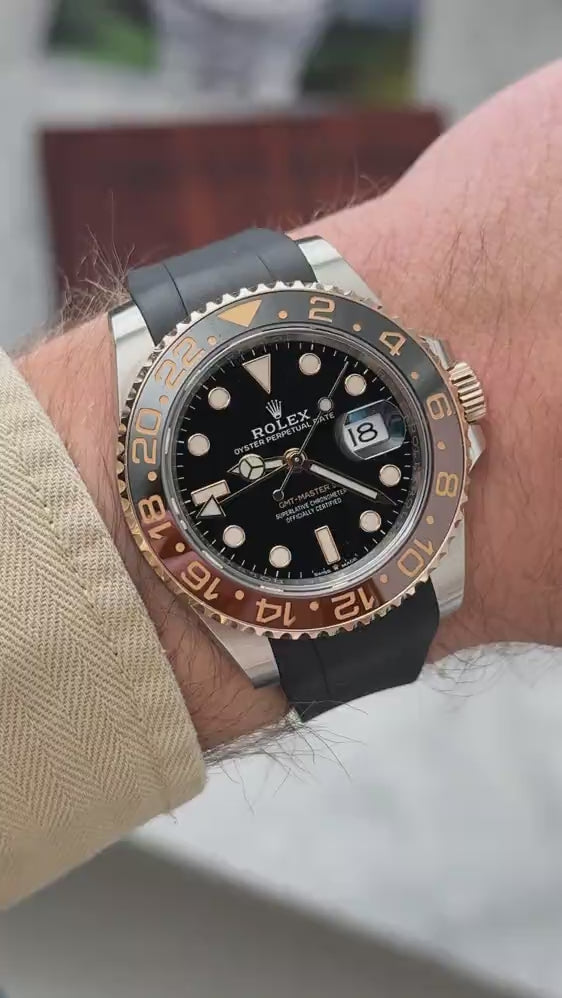 Short UGC clip showing a wrist roll of a  Rolex GMT Master II 126711CHNR with black fkm rubber strap
